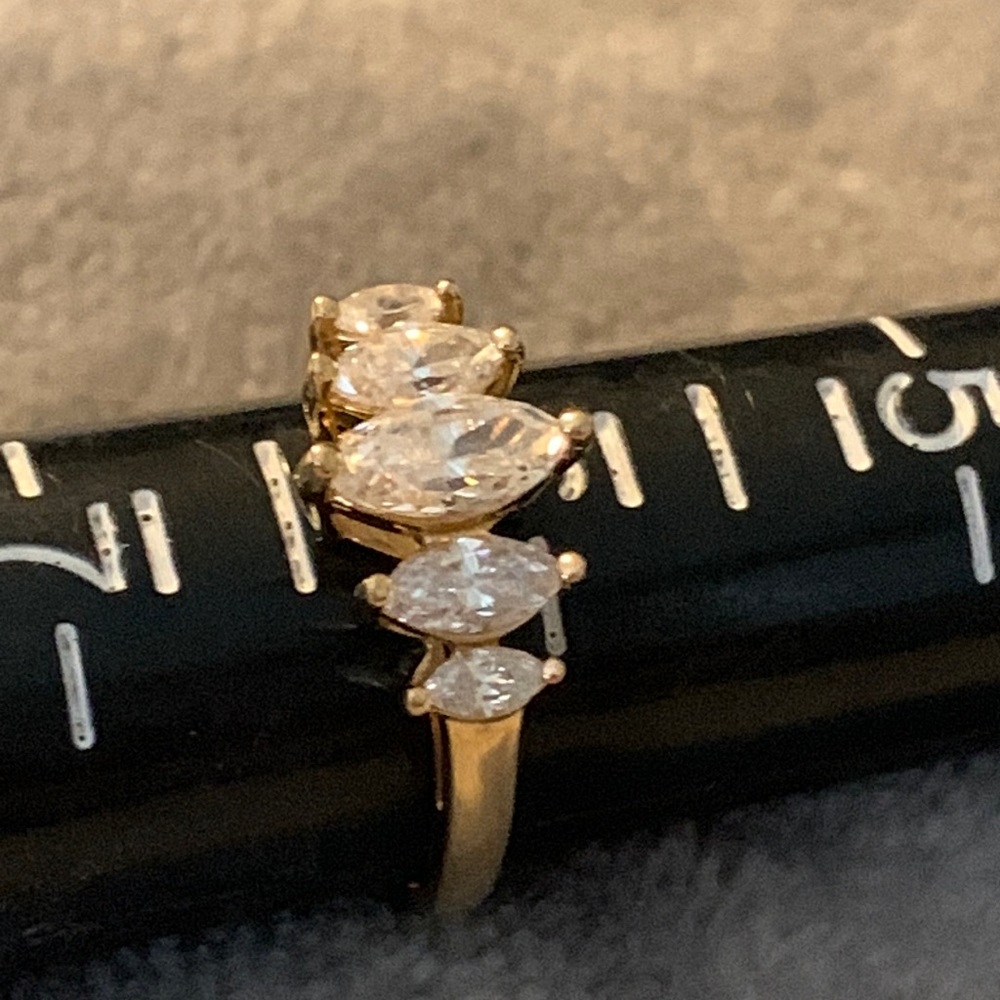Size P14k stamped yellow gold pretty ring with CZs.